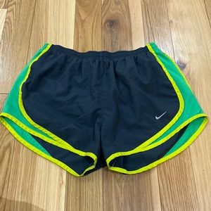 Nike running shorts: green/yellow/black